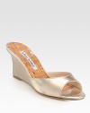 A wedge covered in soft linen heightens this shimmer-kissed metallic leather design. Linen-covered wedge, 3 (75mm)Metallic leather and linen upperCork liningLeather solePadded insoleMade in Italy