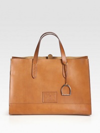 A refined shape of luxurious Italian leather, with an iconic embossed signature logo. Double top handles, 5½ dropDetachable leather zipper pouch15W X 11H X 8DMade in Italy A refined shape of luxurious Italian leather, with an iconic embossed signature logo. Double top handles, 5½ dropDetachable leather zipper pouch15W X 11H X 8DMade in Italy