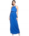 Fit for a goddess: JS Collections' floor length gown features a dramatic V-neckline at the back and the silhouette is cinched to perfection with a matching belt. (Clearance)