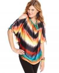 Exude rainbow magic in this oversized top from Jessica Simpson! Boasts a super colorful print -- plus chic cutouts that bare your shoulders and back. Exude rainbow magic in this oversized top from Jessica Simpson! Boasts a super colorful print -- plus chic cutouts that bare your shoulders and back.