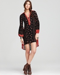 This Free People dress plays up the season's hippie mood, flaunting florals on a loose-fitting silhouette designed with bell sleeves and a of-the-moment high/low hem. This Free People dress plays up the season's hippie mood, flaunting florals on a loose-fitting silhouette designed with bell sleeves and a of-the-moment high/low hem.