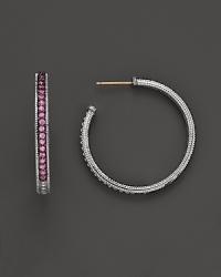 Sparkling sapphires detail a classic pair of sterling silver hoop earrings from Judith Ripka. Sparkling sapphires detail a classic pair of sterling silver hoop earrings from Judith Ripka.