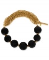 Half stretch, half round beads, full-on fashion. This bracelet from Kenneth Cole New York is crafted from gold-tone mixed metal on one side and semi-precious black agate beads on the other. The result is a stylish statement. Approximate length: 7-1/2 inches.