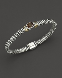 From the Glacier collection, thin caviar rope bracelet with centered smoky topaz stone and gold accents. Designed by Lagos. From the Glacier collection, thin caviar rope bracelet with centered smoky topaz stone and gold accents. Designed by Lagos.