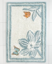 A lovely floral motif in a serene blue and white palette lends an air of nature-inspired sophistication to this Martha Stewart Collection Mariposa bath rug. A smattering of fanciful butterflies add delightful pops of color. A lovely floral motif in a serene blue and white palette lends an air of nature-inspired sophistication to this Martha Stewart Collection Mariposa bath rug. A smattering of fanciful butterflies add delightful pops of color.