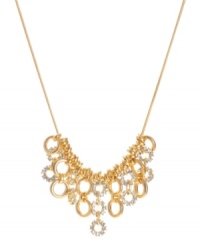 A shimmering mixture of golden rings lend an elegant look to this frontal necklace by Kenneth Cole New York. Crafted of gold tone mixed metal embellished with crystal accents. Approximate length: 16 inches + 3-inch extender. Approximate drop: 1-1/4 inches. A shimmering mixture of golden rings lend an elegant look to this frontal necklace by Kenneth Cole New York. Crafted of gold tone mixed metal embellished with crystal accents. Approximate length: 16 inches + 3-inch extender. Approximate drop: 1-1/4 inches.