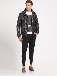 This slick, polished windbreaker is sure to be an outerwear favorite when tested against the season's elements.Zip frontZippered chest, side slash pocketsZip out hoodAbout 27 from shoulder to hemPolyesterMachine washImported This slick, polished windbreaker is sure to be an outerwear favorite when tested against the season's elements.Zip frontZippered chest, side slash pocketsZip out hoodAbout 27 from shoulder to hemPolyesterMachine washImported