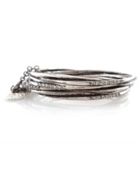 Add sleek sophistication with stackable bangles. From the Jessica Simpson collection, bracelet set features oxidized silvertone mixed metal bangles which can be held together with a 3-inch attachment chain, or worn separately. Each bangle features a row of seven round-cut crystal accents. Approximate diameter: 2-3/4 inches.