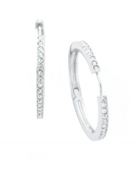 Timeless style with a hint of sparkle. Eliot Danori's traditional hoop earrings experience a dazzling touch with the addition of a seamless row of round-cut crystals. Set in silver tone mixed metal. Approximate diameter: 1-1/8 inches. Timeless style with a hint of sparkle. Eliot Danori's traditional hoop earrings experience a dazzling touch with the addition of a seamless row of round-cut crystals. Set in silver tone mixed metal. Approximate diameter: 1-1/8 inches.