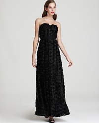 Allover rosettes lend textural dimension to this stunning Jill Stuart Dress strapless gown, nipped at the waist with a chiffon belt. Allover rosettes lend textural dimension to this stunning Jill Stuart Dress strapless gown, nipped at the waist with a chiffon belt.