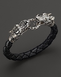 Bold sterling silver dragons link a length of braided leather. From the John Hardy Naga Collection. Bold sterling silver dragons link a length of braided leather. From the John Hardy Naga Collection.