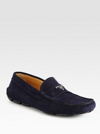 Suede moccasin with metal logo detail. Leather lining Padded insole Rubber sole Made in Italy 