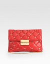 Supple leather, studded with goldtone hardware and suspended from a matching chain shoulder strap.Chain shoulder strap, 12 dropPushlock clasp flap closureDetachable luggage tagOne inside zip pocketTwo inside open pocketsInside credit card slotsFully lined11W X 7H X 1DImported