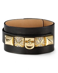Glamor gets gritty with this leather cuff from Juicy Couture, accented by bold pyramid studs. Glamor gets gritty with this leather cuff from Juicy Couture, accented by bold pyramid studs.