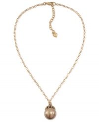 Have yourself a ball with this pendant necklace from Carolee. Crafted from gold-tone mixed metal, the necklace gets a bit of glamour with a glass pearl pendant at the center. Approximate length: 16 inches. Approximate drop: 1 inch. Have yourself a ball with this pendant necklace from Carolee. Crafted from gold-tone mixed metal, the necklace gets a bit of glamour with a glass pearl pendant at the center. Approximate length: 16 inches. Approximate drop: 1 inch.