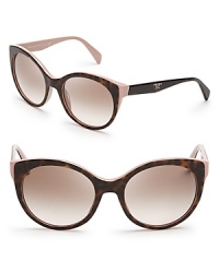 Prada brings its elegant aesthetic and mastery of '50s style to the ultra-fashionable cat eye in these appealing sunglasses. Prada brings its elegant aesthetic and mastery of '50s style to the ultra-fashionable cat eye in these appealing sunglasses.