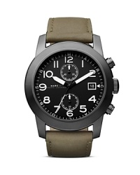 A handsome two-eye chronograph dial punctuates this military styled MARC BY MARC JACOBS watch, completed by a chic leather strap. A handsome two-eye chronograph dial punctuates this military styled MARC BY MARC JACOBS watch, completed by a chic leather strap.