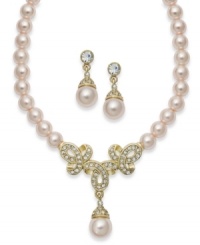 Inspire your look with something sophisticated. This Charter Club jewelry set combines pink simulated pearls with a multitude of round-cut crystals in pretty patterns. Setting crafted in gold tone mixed metal. Approximate length: 16 inches + 2-inch extender. Approximate drop (earring): 1-1/3 inches. Set comes packaged in a signature gift set. Inspire your look with something sophisticated. This Charter Club jewelry set combines pink simulated pearls with a multitude of round-cut crystals in pretty patterns. Setting crafted in gold tone mixed metal. Approximate length: 16 inches + 2-inch extender. Approximate drop (earring): 1-1/3 inches. Set comes packaged in a signature gift set.