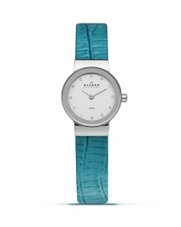 Add a sleek shot of color to your look with this watch from Skagen. Accented by a bold blue leather band, it boasts an understated silhouette and advanced Japanese quartz movement for the perfect fusion of form and function. Add a sleek shot of color to your look with this watch from Skagen. Accented by a bold blue leather band, it boasts an understated silhouette and advanced Japanese quartz movement for the perfect fusion of form and function.