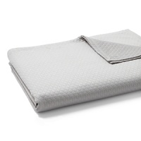 Stitching in an oval band pattern on this coverlet creates a calming, quilted wave effect. Stitching in an oval band pattern on this coverlet creates a calming, quilted wave effect.