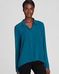 Semi-sheer chiffon lends a seductive twist to this BCBGeneration shirt, complete with an on-trend high/low hem. Semi-sheer chiffon lends a seductive twist to this BCBGeneration shirt, complete with an on-trend high/low hem.