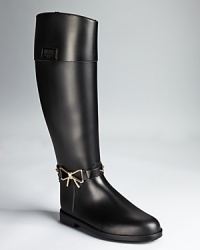 In a riding boot silhouette, Moschino Cheap and Chic's bow-detailed rain boots lend a smart, equestrian look to days with unfavorable weather. In a riding boot silhouette, Moschino Cheap and Chic's bow-detailed rain boots lend a smart, equestrian look to days with unfavorable weather.