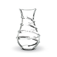 Designed by Thomas Bastide, this elegant Baccarat Carnaval vase will have people stepping right up to see its twirling, spiral design. A narrow neck makes it ideal for arranging flowers.