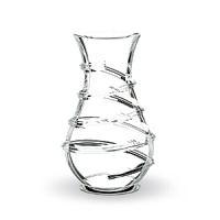 Designed by Thomas Bastide, this elegant Baccarat Carnaval vase will have people stepping right up to see its twirling, spiral design. A narrow neck makes it ideal for arranging flowers. Designed by Thomas Bastide, this elegant Baccarat Carnaval vase will have people stepping right up to see its twirling, spiral design. A narrow neck makes it ideal for arranging flowers.