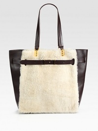 A beautifully tactile style in soft shearling and supple leather, perfect for all your daily essentials.Double shoulder straps, 10½ dropOpen topOne detachable zip pouchMetallic leather lining13W X 13½H X 5DMade in Italy A beautifully tactile style in soft shearling and supple leather, perfect for all your daily essentials.Double shoulder straps, 10½ dropOpen topOne detachable zip pouchMetallic leather lining13W X 13½H X 5DMade in Italy