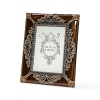 Finely detailed frame with sable colored enamel and topaz Swarovski crystals.