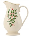 Perfect for entertaining, this porcelain pitcher is trimmed with gold and a holly motif to match the beloved Lenox Holiday dinnerware collection.