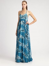 A traditional, tropical Hawaiian print decorates this sweeping floor-length style.Sweetheart halter neckline with tie closureEmpire waistFull gathered skirtLow back with gathers and signature loop detailAbout 40½ from natural waistRayonDry cleanMade in Italy of imported fabricModel shown is 5'10 (177cm) wearing US size 4. A traditional, tropical Hawaiian print decorates this sweeping floor-length style.Sweetheart halter neckline with tie closureEmpire waistFull gathered skirtLow back with gathers and signature loop detailAbout 40½ from natural waistRayonDry cleanMade in Italy of imported fabricModel shown is 5'10 (177cm) wearing US size 4.