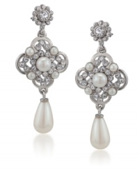 Stately and stylish. Exquisitely crafted with simulated pearls and sparkling glass accents, Carolee's linear teardrop earrings will add a regal touch to your look for daytime or evening. Set in silver tone mixed metal. Approximate drop: 2-3/4 inches. Stately and stylish. Exquisitely crafted with simulated pearls and sparkling glass accents, Carolee's linear teardrop earrings will add a regal touch to your look for daytime or evening. Set in silver tone mixed metal. Approximate drop: 2-3/4 inches.