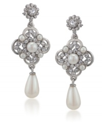 Stately and stylish. Exquisitely crafted with simulated pearls and sparkling glass accents, Carolee's linear teardrop earrings will add a regal touch to your look for daytime or evening. Set in silver tone mixed metal. Approximate drop: 2-3/4 inches.