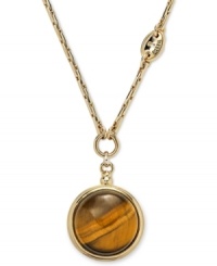 Eye of the tiger. This exotic pendant necklace from Fossil features a watch fob-inspired pendant with a round tiger's eye bead. Crafted in shiny gold tone mixed metal. Approximate length: 16 inches + 2-inch extender. Approximate drop: 1-1/2 inches. Eye of the tiger. This exotic pendant necklace from Fossil features a watch fob-inspired pendant with a round tiger's eye bead. Crafted in shiny gold tone mixed metal. Approximate length: 16 inches + 2-inch extender. Approximate drop: 1-1/2 inches.