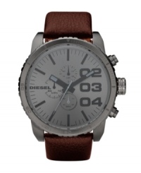 If bigger is better, this modern watch by Diesel is the best. Brown leather strap and oversized round gunmetal ion-plated stainless steel case, 58x52mm. Gunmetal chronograph dial features charcoal numerals, stick indices, minute track, three subdials, luminous hands and logo. Quartz movement. Water resistant to 50 meters. Two-year limited warranty. If bigger is better, this modern watch by Diesel is the best. Brown leather strap and oversized round gunmetal ion-plated stainless steel case, 58x52mm. Gunmetal chronograph dial features charcoal numerals, stick indices, minute track, three subdials, luminous hands and logo. Quartz movement. Water resistant to 50 meters. Two-year limited warranty.