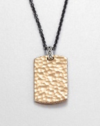 From the Palu Collection. The hand-hammered design motif of the Palu collection distinguishes a bronze dog tag pendant, connected by a sterling silver bale to a bold chain of blackened stainless steel.Bronze and sterling silverStainless steelChain length, about 24Pendant, about 2L X 1WLobster claspMade in Bali