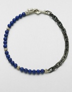 A brilliant strand of smooth lapis beads joins together with intricate links of sterling silver and stainless steel, and is finished with a sculpted sterling silver clasp.LapisSterling silver/stainless steelAbout 3 diam.Imported