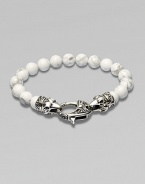 A new look for the modern man, handsomely crafted with a sterling silver raven's head clasp and a string of howlite beads.Sterling silverLobster claspBracelet, 9 longAbout 3 diamImported