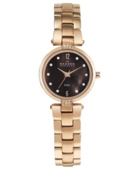 This glamorous watch from Skagen Denmark displays simple elegance with rosy tones and crystal accents. This glamorous watch from Skagen Denmark displays simple elegance with rosy tones and crystal accents.