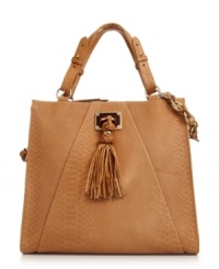 A luxe leather look from Elliott Lucca. This fashion-forward tote with shiny goldtone hardware and fun tassel detail easily takes you from a long day at work to dinner on the town. A luxe leather look from Elliott Lucca. This fashion-forward tote with shiny goldtone hardware and fun tassel detail easily takes you from a long day at work to dinner on the town.