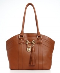 Shoot for something sophisticated this season with this impossibly chic silhouette from Calvin Klein. Elegant and understated but big on style, it features subtle signature hardware with tassel and chain-link accents, making this super spacious tote the ultimate it-accessory for everyday. Shoot for something sophisticated this season with this impossibly chic silhouette from Calvin Klein. Elegant and understated but big on style, it features subtle signature hardware with tassel and chain-link accents, making this super spacious tote the ultimate it-accessory for everyday.