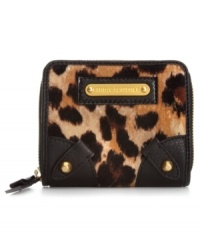 A petite version of its ultra-glam big sister, this mini Juicy Couture wallet showcases the same posh velour leopard print, soft leather trim and shiny golden hardware. Plenty of interior pockets easily hold cards, cash, coins and ID, and it discretely slips into any purse without a worry.