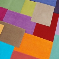 A bright, color-blocked rug adds a modern sense of style to any bath. A bright, color-blocked rug adds a modern sense of style to any bath.