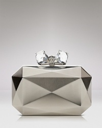 A bolder-is-better nighttime statement piece: this Overture Judith Leiber clutch features a faceted metal exterior, detailed with a bow ornament. An interior holds your smartphone and life's little essentials. A bolder-is-better nighttime statement piece: this Overture Judith Leiber clutch features a faceted metal exterior, detailed with a bow ornament. An interior holds your smartphone and life's little essentials.