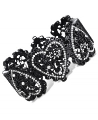 Heartfelt appreciation. This bangle bracelet from Betsey Johnson is crafted from black-plated mixed metal with glass crystal accents adding a lustrous touch. Approximate diameter: 2-3/8 inches. Heartfelt appreciation. This bangle bracelet from Betsey Johnson is crafted from black-plated mixed metal with glass crystal accents adding a lustrous touch. Approximate diameter: 2-3/8 inches.