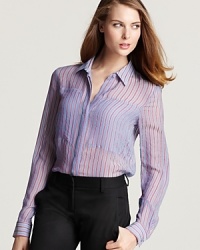 A sheer silk Theory top offers an feminine take on a classic style, with the addition of a high/low hem for a dose of modernity. A sheer silk Theory top offers an feminine take on a classic style, with the addition of a high/low hem for a dose of modernity.