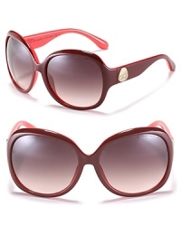 Round oversized sunglasses in a cool two tone combination with signature Miss Marc logo at temples. Round oversized sunglasses in a cool two tone combination with signature Miss Marc logo at temples.