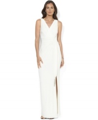Indulge your inner Greek goddess in Lauren Ralph Lauren's floor-sweeping gown with a ruched bodice and beaded tassels at the waist for sophisticated flair. Indulge your inner Greek goddess in Lauren Ralph Lauren's floor-sweeping gown with a ruched bodice and beaded tassels at the waist for sophisticated flair.