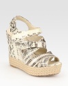 Snake-print leather complemented by an adjustable slingback strap and a timeless espadrille wedge. Leather and hemp wedge, 4½ (115mm)Hemp platform, 1 (25mm)Compares to a 3½ heel (90mm)Snake-print leather upperLeather lining and solePadded insoleImported